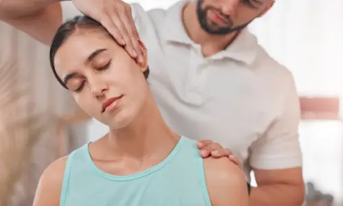 A young woman receiving neck pain treatments from a skilled practitioner.